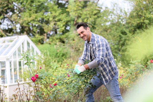 Team member handling garden service payment and invoice paperwork